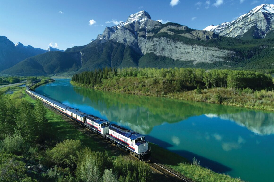A scenic train traveling through the Canadian Rocky Mountains
